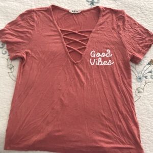Deep v-neck “good vibes” tee